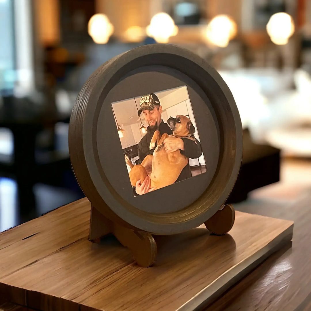 Medium wooden Beagle size Halo Frame from Whisker & Fang with a boxer and a smiling man, displayed indoors.