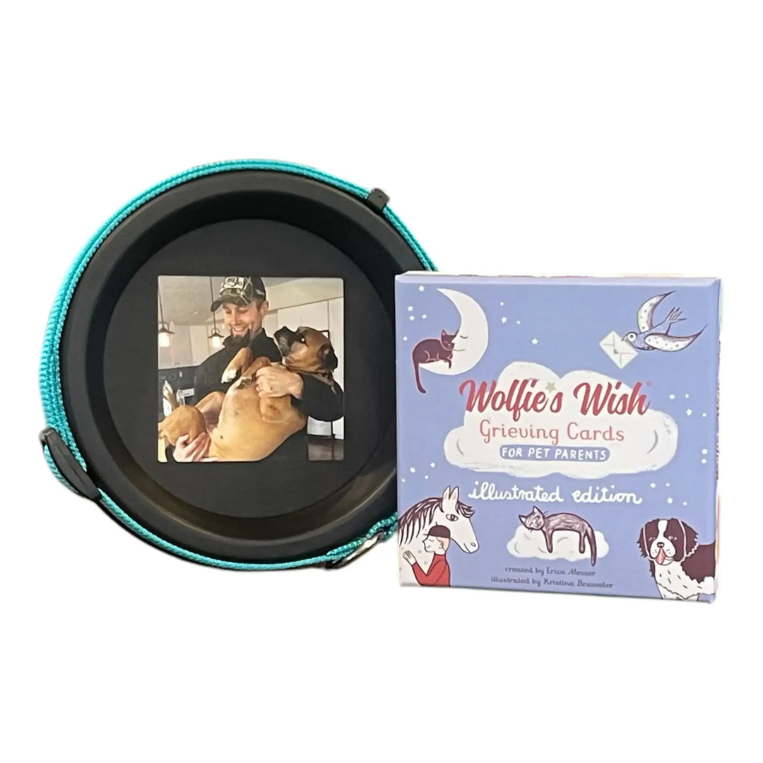 Product display of the Tribute and Comfort Bundle against a white background, including a black collar frame with a dog photo and Wolfie’s Wish grieving cards box.