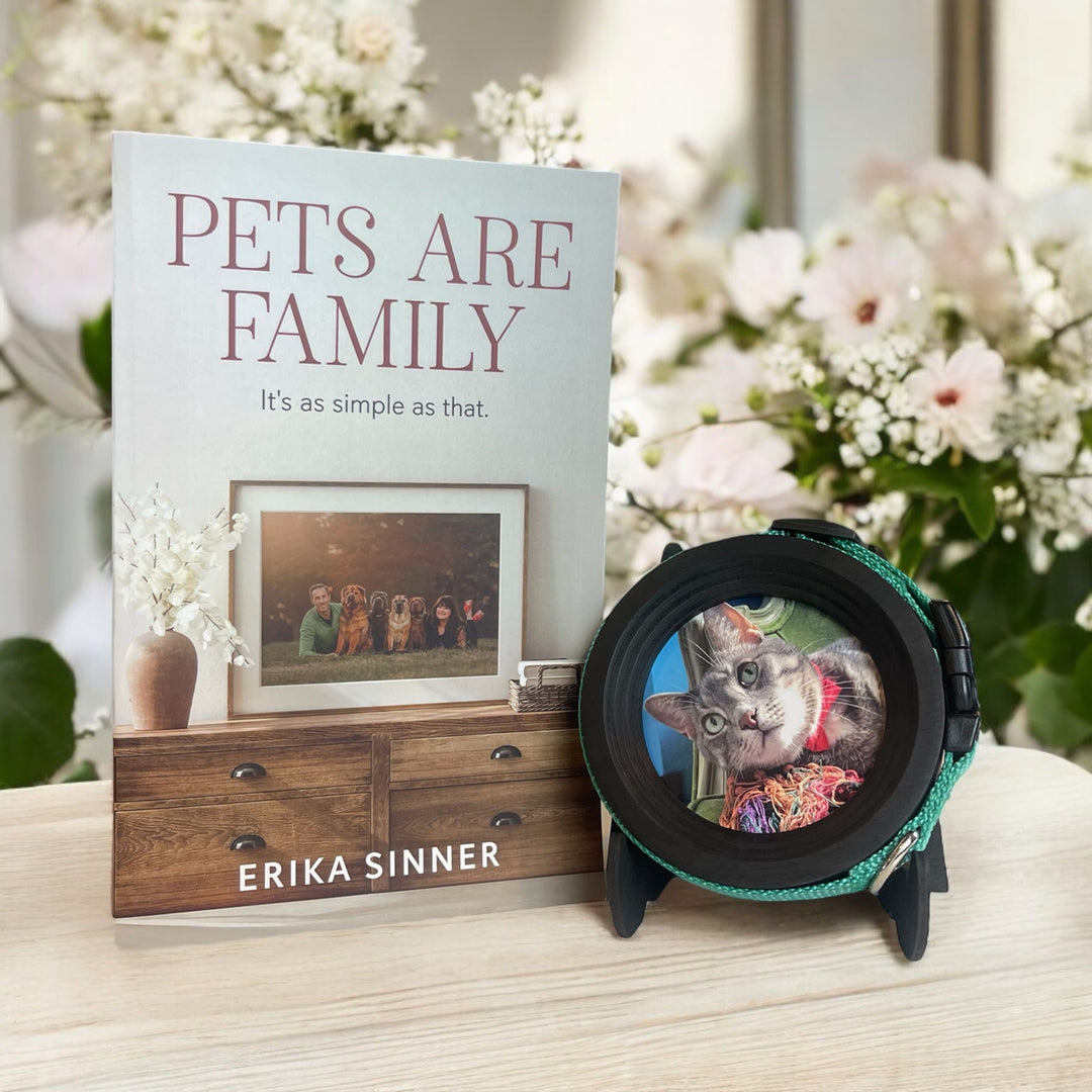 Pets Are Family paperback book by Erika Sinner with black wooden Halo Frame & Collar Display for cat collars. 