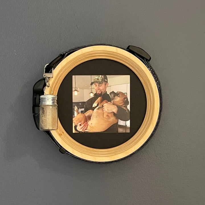 medium extra wide dog collar wooden picture frame with fur keepsake capsule on a dark wall