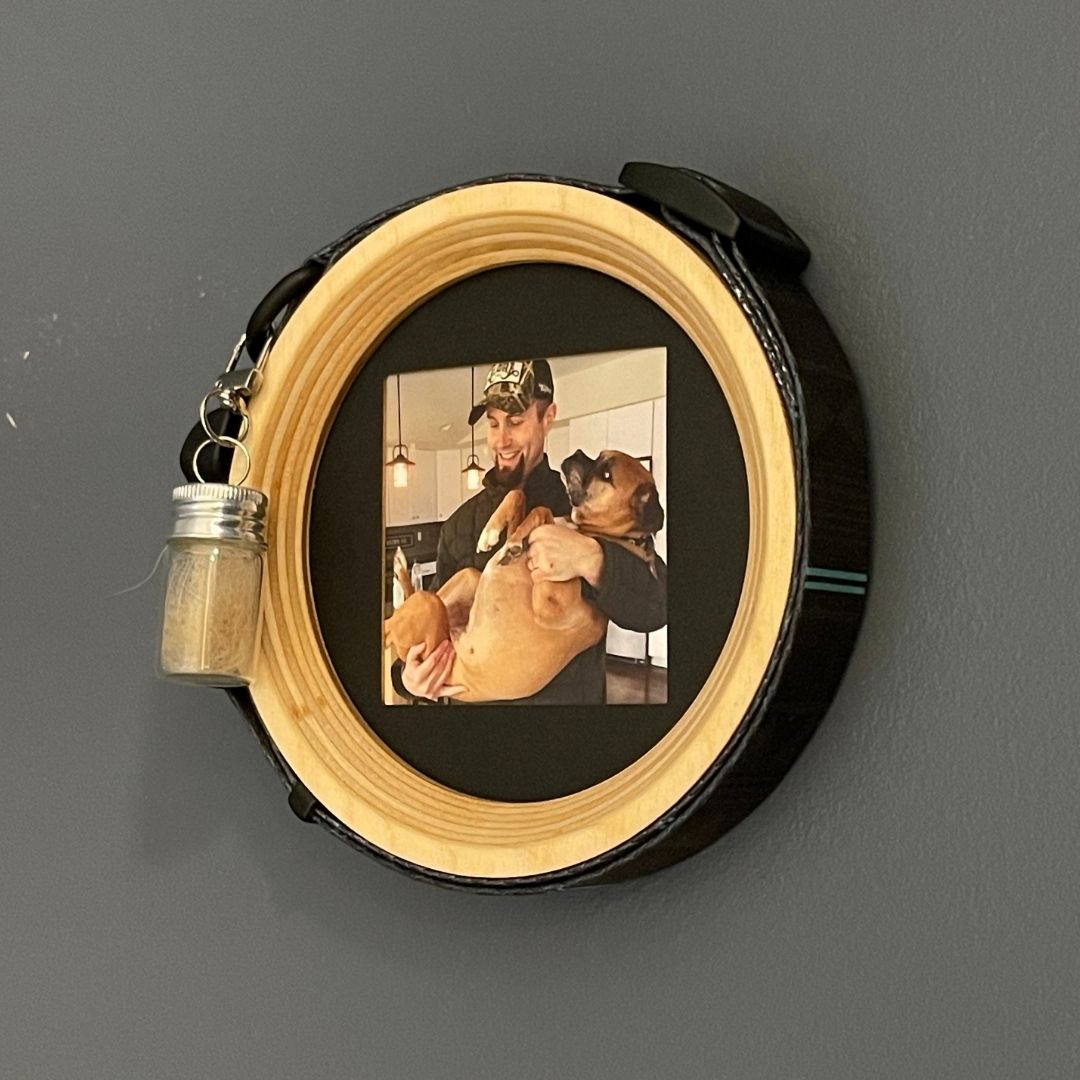 medium wood dog collar display frame and fur keepsake capsule on dark wall